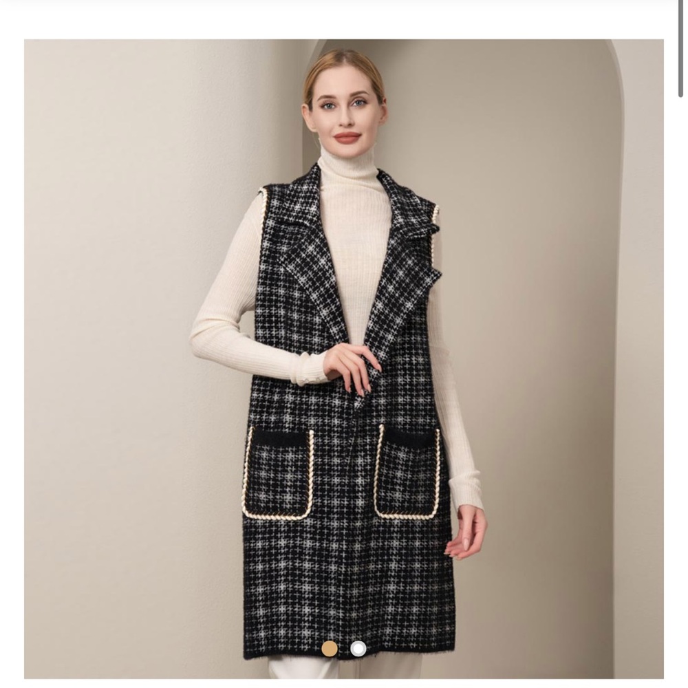 Beautiful, soft, cozy, long vest. Has pockets, trim around arms and pockets